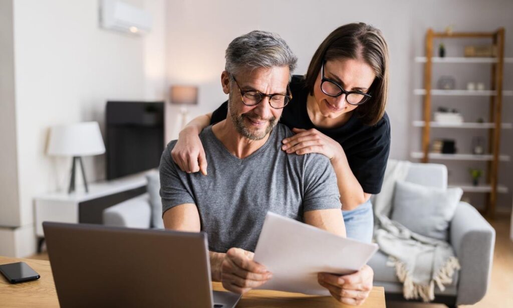 Couple reviewing Auckland home renovation budget at home