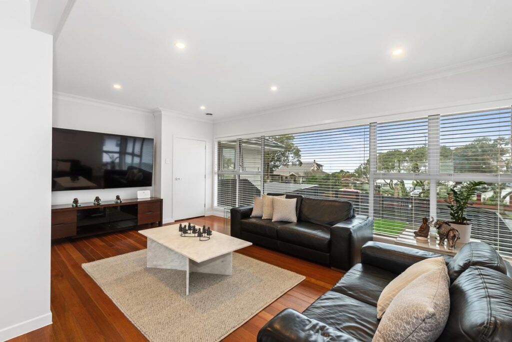 Finished Blockhouse Bay living room with painted internal door, renovated by Add Value Renovations