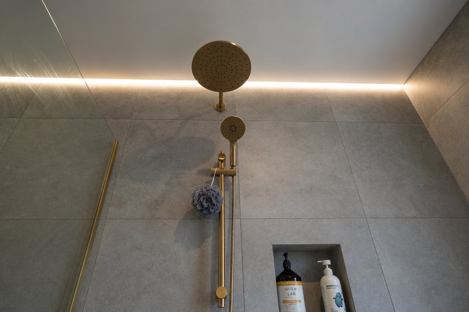 Hillsborough bathroom &mdash; brushed gold shower set, Venture Travertine tiles