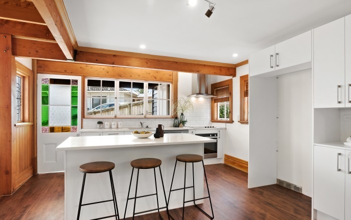 Renovated Lockwood kitchen with breakfast bar and original stained glass