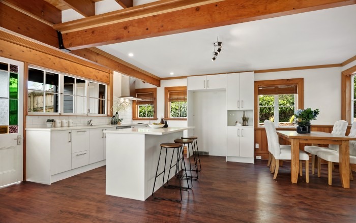 Lockwood kitchen renovation with white island, dining area and dark timber flooring