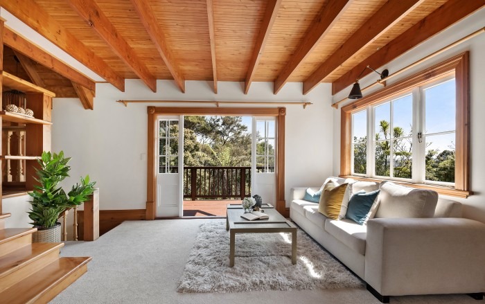 Lockwood living room with exposed pine beam ceiling and French doors