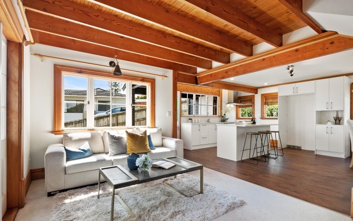 Lockwood home renovation — open-plan living and kitchen with exposed beam ceiling