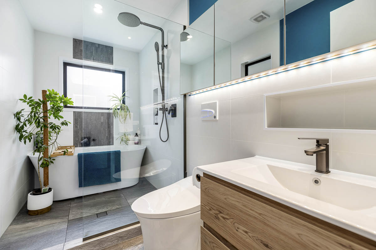 Renovated bathroom with tiled shower and modern finish — Lynfield bathroom renovation by Add Value Renovations