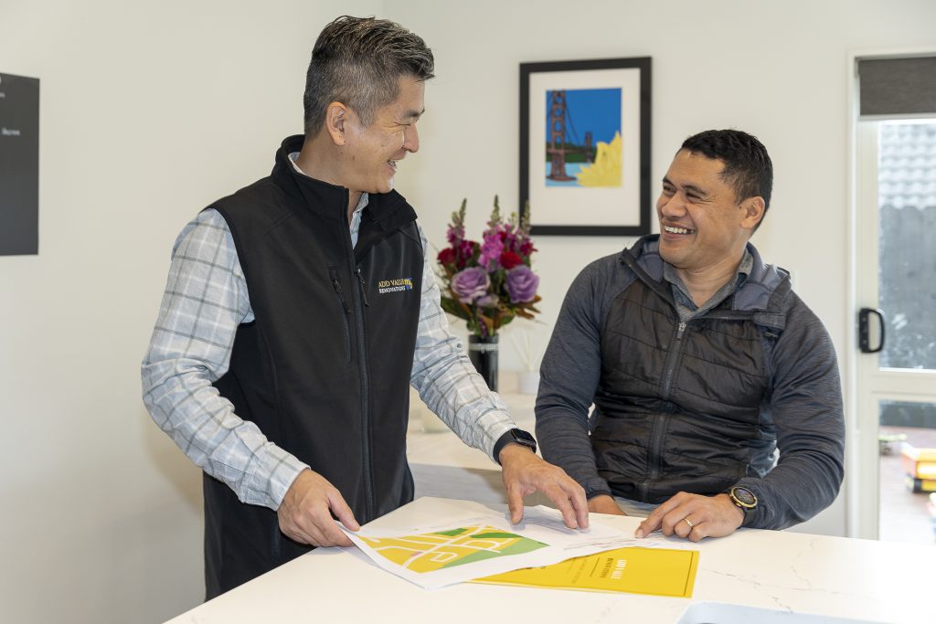 Simon Liu of Add Value Renovations reviewing renovation plans with a client at the consultation stage
