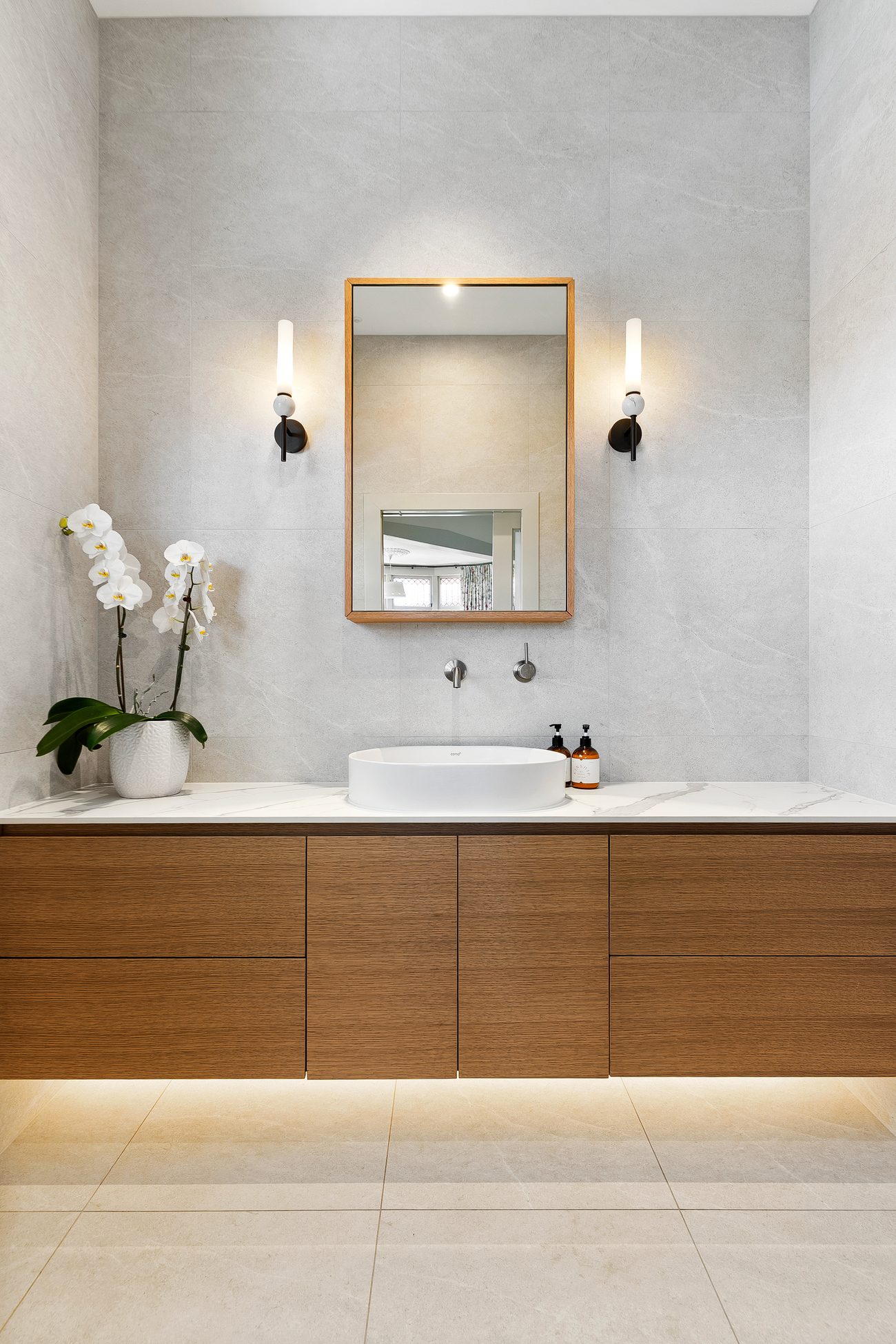 Custom veneer vanity, centred basin and symmetrical wall lights — Remuera bungalow ensuite