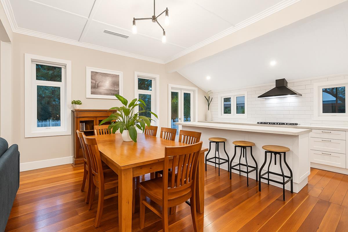 West Auckland bungalow open-plan kitchen renovation by Add Value Renovations — wall removed, kitchen merged with dining